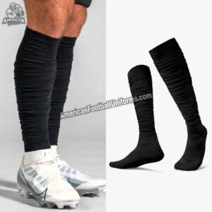 Structural view of white and black football socks highlighting the reinforced arch band and ankle support for injury prevention.