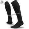 Youth American football socks in white and black with targeted cushioning at the heel and toe for high-impact protection.