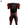 Full view of a custom red and black American football uniform including matching pants with reinforced side piping and belt.