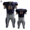 Youth American football uniform set in grey and navy with integrated padding slots and high-stretch performance spandex.